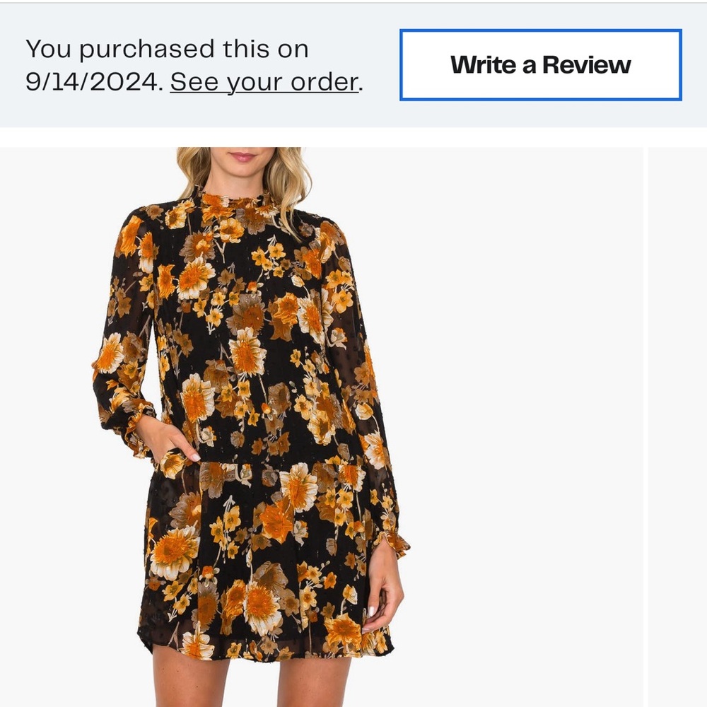 Pretty short black and yellow dress with pockets. Ruffle neck/long sleeves